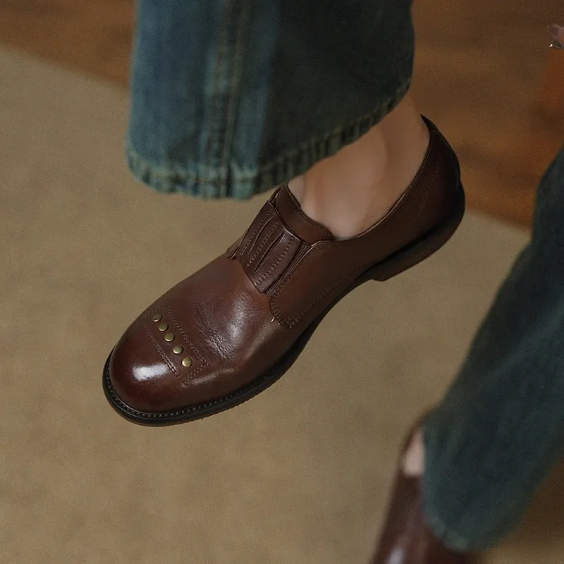 Retro Cowhide Round Toe Rivet Decorated Low Heel Loafers in Black/Brown